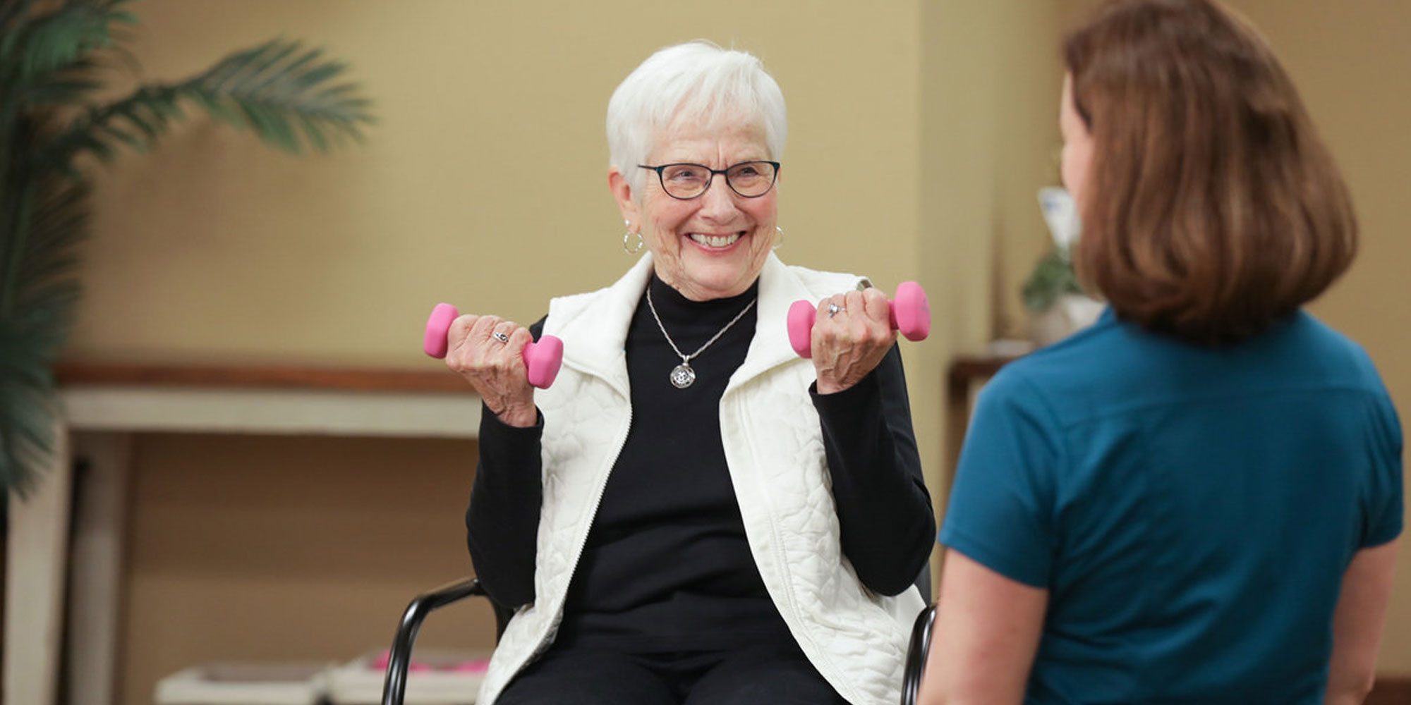 Heritage OnCare Physical Therapist assisting elderly woman with her exercises